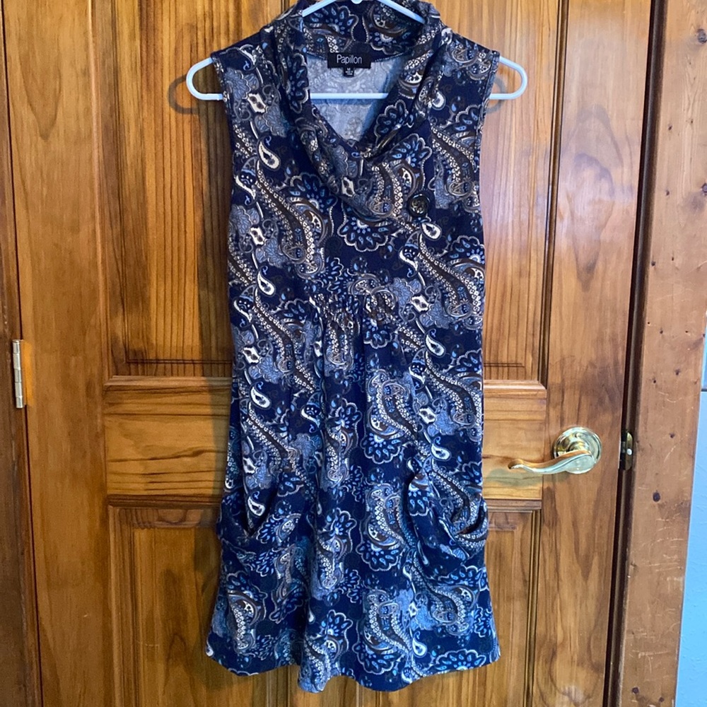 Sweater dress with two pockets and cowl neck.